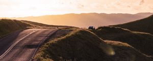 Preview wallpaper road, hilly, relief, landscape, sunrise