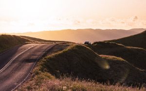 Preview wallpaper road, hilly, relief, landscape, sunrise