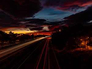 Preview wallpaper road, light, long exposure, trees, sunset, dark