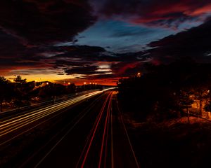 Preview wallpaper road, light, long exposure, trees, sunset, dark