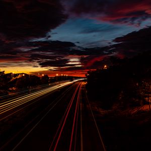 Preview wallpaper road, light, long exposure, trees, sunset, dark