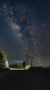 Preview wallpaper road, light, man, alone, night, starry sky