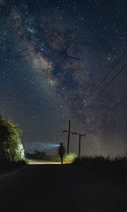 Preview wallpaper road, light, man, alone, night, starry sky