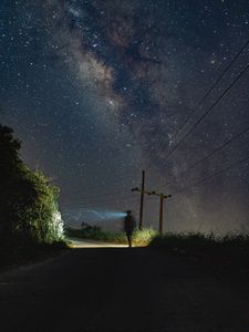 Preview wallpaper road, light, man, alone, night, starry sky