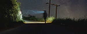 Preview wallpaper road, light, man, alone, night, starry sky