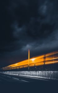 Preview wallpaper road, light, pillar, sky, clouds, night