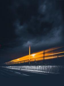 Preview wallpaper road, light, pillar, sky, clouds, night