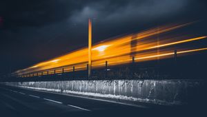 Preview wallpaper road, light, pillar, sky, clouds, night