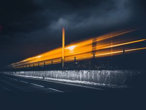 Preview wallpaper road, light, pillar, sky, clouds, night