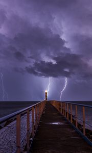 Preview wallpaper road, lighthouse, lightning, sea, dark, clouds