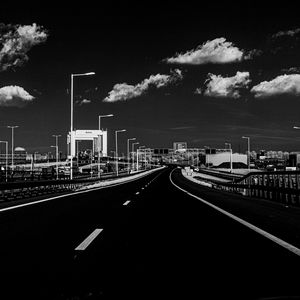 Preview wallpaper road, lights, clouds, black and white