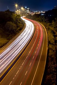 Preview wallpaper road, lights, freezelight, night, city, trees