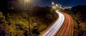 Preview wallpaper road, lights, freezelight, night, city, trees