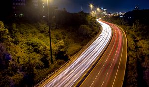 Preview wallpaper road, lights, freezelight, night, city, trees