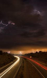 Preview wallpaper road, lights, lightning, clouds, night, freezelight