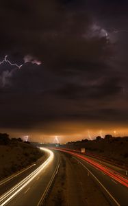 Preview wallpaper road, lights, lightning, clouds, night, freezelight