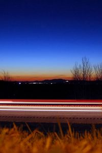 Preview wallpaper road, line, lines, grass, evening