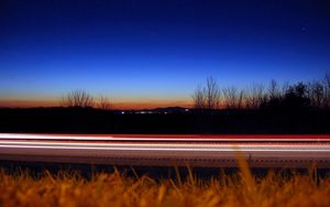 Preview wallpaper road, line, lines, grass, evening