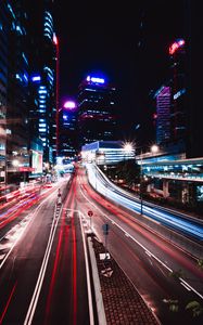 Preview wallpaper road, long exposure, lights, buildings, city