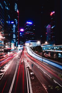 Preview wallpaper road, long exposure, lights, buildings, city