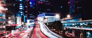 Preview wallpaper road, long exposure, lights, buildings, city