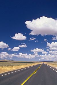 Preview wallpaper road, marking, asphalt, line, yellow, strip, clouds, roadside