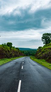 Preview wallpaper road, marking, grass, rocks, distance