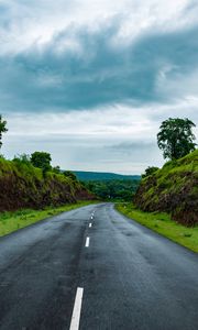 Preview wallpaper road, marking, grass, rocks, distance