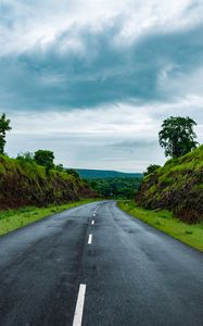 Preview wallpaper road, marking, grass, rocks, distance