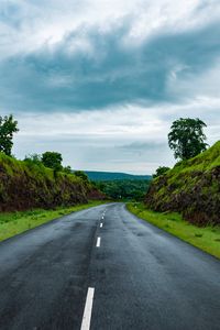 Preview wallpaper road, marking, grass, rocks, distance