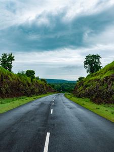 Preview wallpaper road, marking, grass, rocks, distance