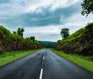 Preview wallpaper road, marking, grass, rocks, distance