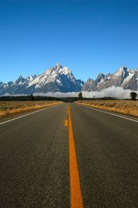 Preview wallpaper road, marking, line, yellow, mountains, fog, asphalt