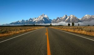 Preview wallpaper road, marking, line, yellow, mountains, fog, asphalt