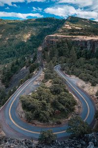 Preview wallpaper road, marking, rocks, trees, forest