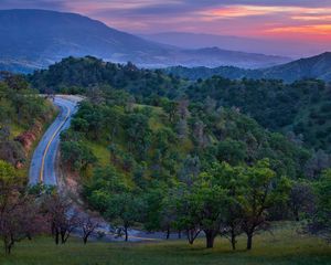 Preview wallpaper road, mountain, asphalt, relief, evening, decline, trees, look