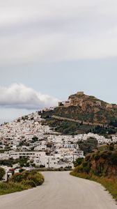 Preview wallpaper road, mountain, buildings, city
