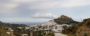 Preview wallpaper road, mountain, buildings, city