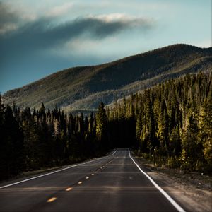 Preview wallpaper road, mountain, forest, direction, marking, sky