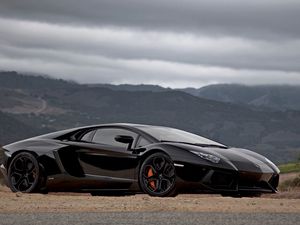 Preview wallpaper road, mountain, sky, stylish cars, lamborghini