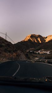 Preview wallpaper road, mountains, buildings, asphalt, winding