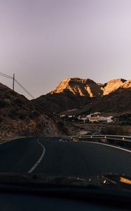 Preview wallpaper road, mountains, buildings, asphalt, winding