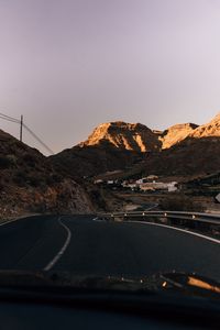 Preview wallpaper road, mountains, buildings, asphalt, winding