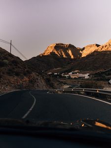 Preview wallpaper road, mountains, buildings, asphalt, winding