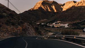 Preview wallpaper road, mountains, buildings, asphalt, winding