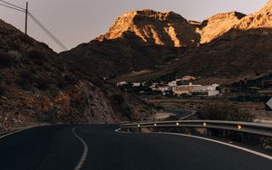 Preview wallpaper road, mountains, buildings, asphalt, winding