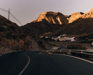 Preview wallpaper road, mountains, buildings, asphalt, winding