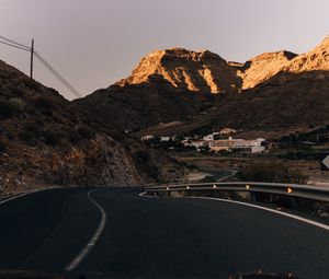 Preview wallpaper road, mountains, buildings, asphalt, winding