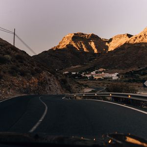 Preview wallpaper road, mountains, buildings, asphalt, winding