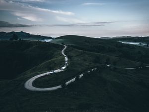 Preview wallpaper road, mountains, fog, winding